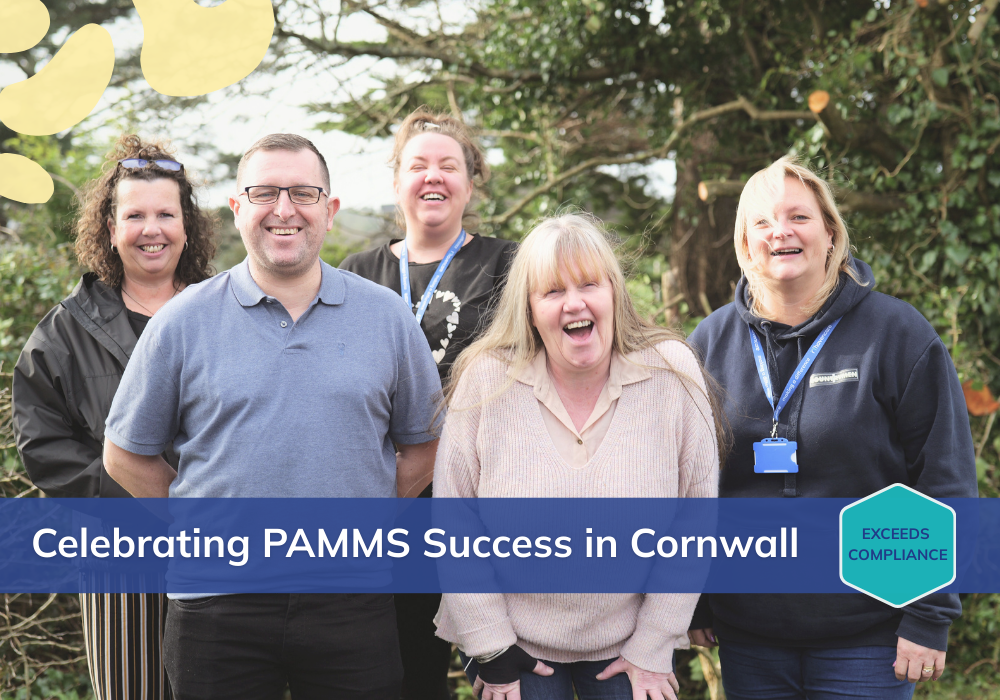Five smiling Havencare Cornwall team members standing outdoors, featuring a blue banner that reads "Celebrating PAMMS Success in Cornwall" with an "Exceeds Compliance" badge.
