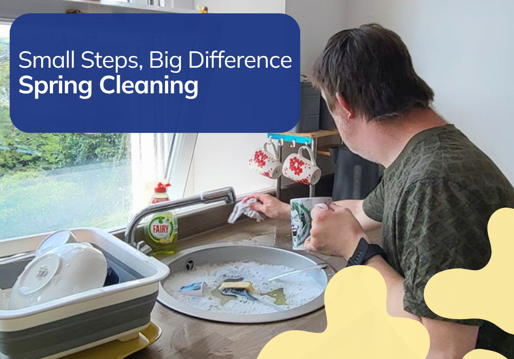 A man washes up at a kitchen sink with a dish rack and Fairy washing up liquid nearby. Text reads: Small Steps, Big Difference — Spring Cleaning.